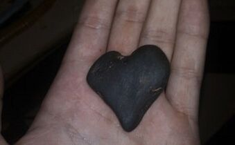 Heart-shaped stone as an amulet of good luck