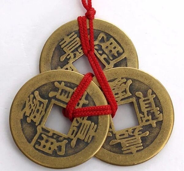 Coin with red thread, good luck